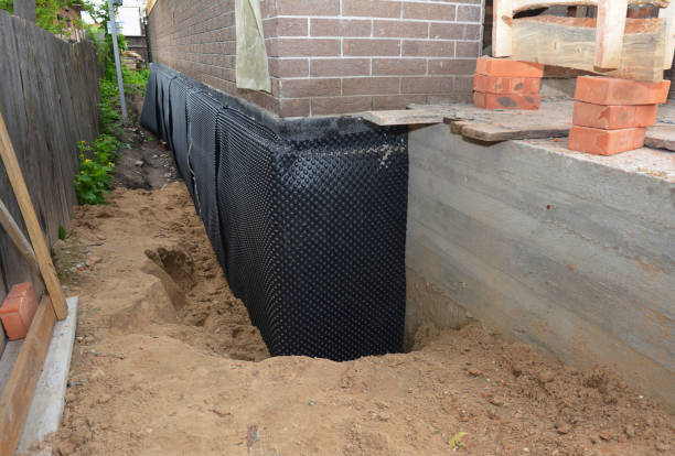 SJ Waterproofing Pros technician performing targeted Exterior Waterproofing assessment in Adamsville, AL